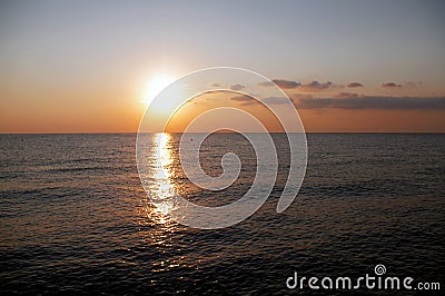 Sunrise over the sea against the sky. Stock Photo