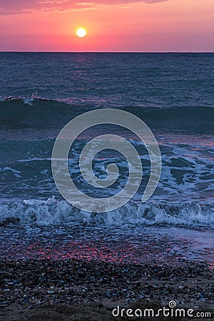 Sunrise over the sea and waves Stock Photo