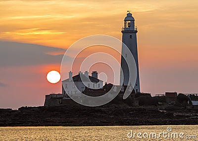 Sunrise over St Marys Lighthouse Stock Photo