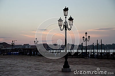 Sunrise over street lamps on San Marco square Stock Photo