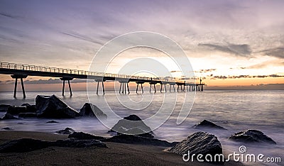 Sunrise on the Pont del petroli beach with silky water. Stock Photo