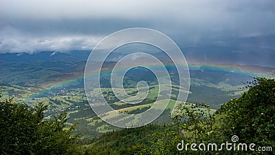 Sunrise with rainbow on a summer day. Stock Photo