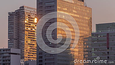 Sunrise reflected in Donaustadt Danube City modern skyscrapers and business centres timelapse in Vienna, Austria. Stock Photo