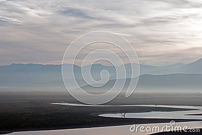 Sunrise reflections on drought stricken Lake Isabella in the southern Sierra Nevada mountains of California Stock Photo