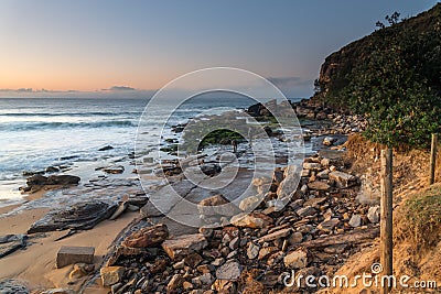Sunrise seascape with beach erosion Editorial Stock Photo