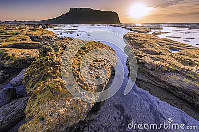 Sunrise at Seongsan Ilchulbong and misty,South Korea Stock Photo