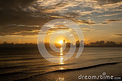Sunrise shot over the sea and beautiful cloud. sun disappeared behind a big cloud over ocean Stock Photo
