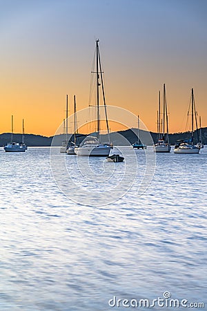 Sunrise and Silhouettes, Boats on the Bay Stock Photo