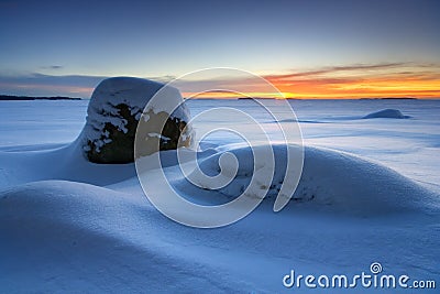 Sunrise and snowy beach Stock Photo