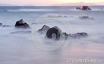 Sunrise Sunlight East Coast Tasmania Slow shutter speed water over rocks Stock Photo