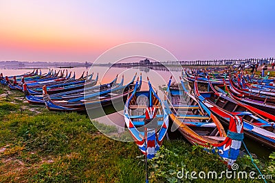 Sunrise at U Bein Bridge with boat, Mandalay, Myanmar. Stock Photo