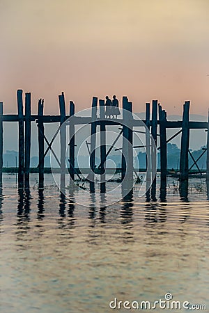 Sunrise on U Bein bridge near Mandalay in Myanmar Stock Photo