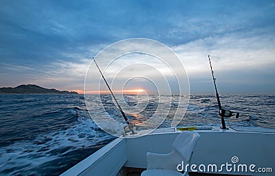Sunrise view of fishing rod on charter fishing boat on the Pacific side of Cabo San Lucas in Baja California Mexico Stock Photo