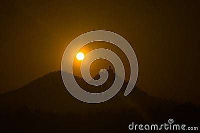 Sunrise and view of the silhouette of the castle Stock Photo