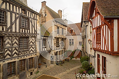 Square with half-timbered houses, in the medieval village Noyers-sur-Serein Stock Photo