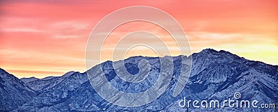 Sunrise of Winter panoramic, view of Snow capped Wasatch Front Rocky Mountains, Great Salt Lake Valley and Cloudscape from the Mou Stock Photo