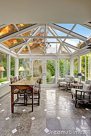 Sunroom patio area with transparent vaulted ceiling Stock Photo