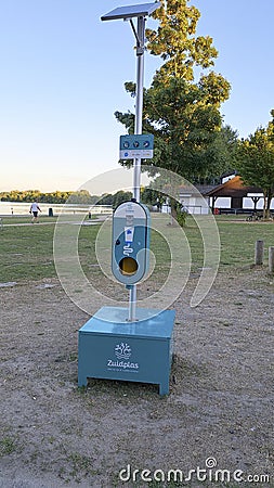 Sunscreen portion dispenser for bathers for prevention against skin cancer Editorial Stock Photo