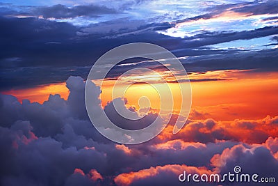 Sunset above the clouds Stock Photo