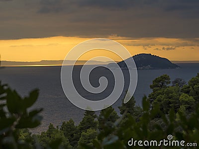 Sunset above the sea. Orange sky. Kelifos island. Greece. Stock Photo
