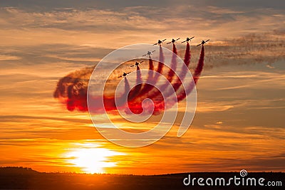 Sunset with acrobatics seven aviation Stock Photo