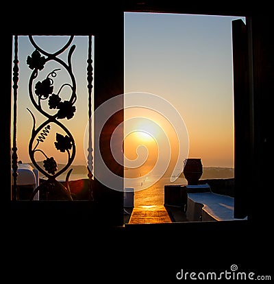 Sunset in the aegean sea from a house. Santorini island Greece. Stock Photo