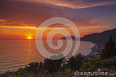 Sunset Agios Gordios beach-side village, Corfu, Greece Stock Photo