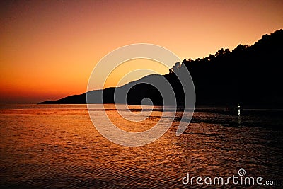 Sunset at Agnontas beach, Skopelos, Greece Stock Photo
