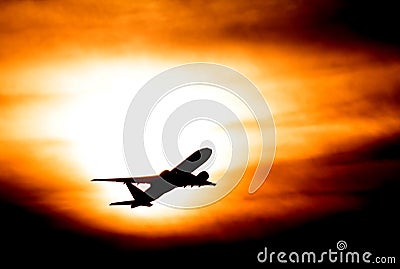 Sunset with airplane Stock Photo