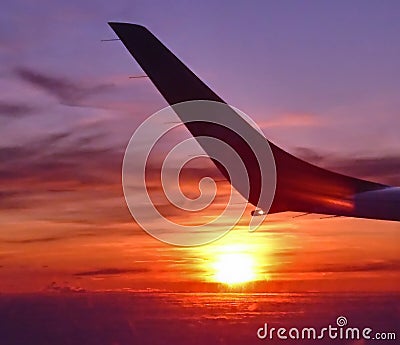 Sunset from airplane during flight Stock Photo