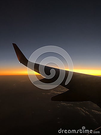 Sunset from airplane window view Stock Photo