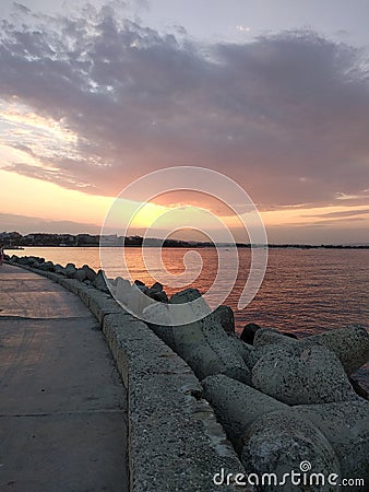 Sunset, alley near the sea Stock Photo