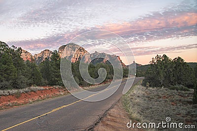 Sunset on highway with view of Sedona red rock formations in Arizona, USA Stock Photo