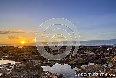 Sunset Atlantic Ocean view at Dar Bouazza beach, in Tamarist, Stock Photo