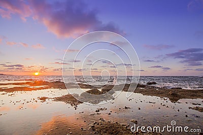 Sunset Atlantic Ocean view at Dar Bouazza rocky beach Stock Photo