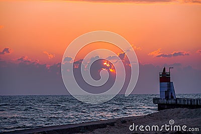 Sunset on the Atlantic ocean, view on lighthouse. Wallpapers concept Stock Photo