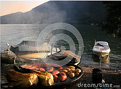 Sunset barbecue with boats Stock Photo