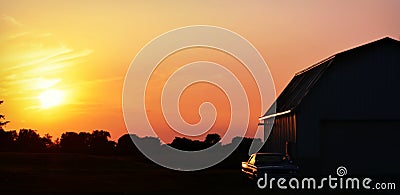 Sunset Barn, Antique Car Stock Photo