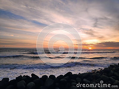 Sunset on beach nature cloudly with stones Stock Photo