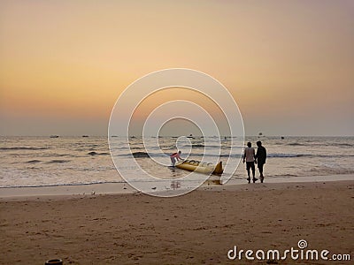 Sunset on a beach, with orange sky Editorial Stock Photo
