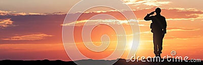 Soldier Saluting During Sunset Stock Photo