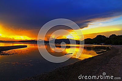 Sunset on beach and silhouette at Baan Koh Teab Stock Photo