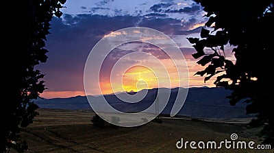 Sunset in beautiful Armenia Aragac or sundown is the daily disappearance of the Sun below the horizon, as a re Stock Photo