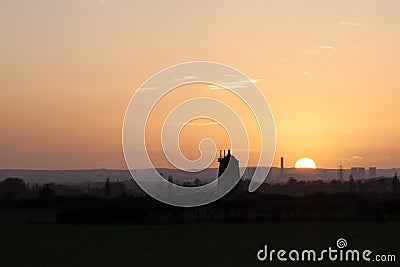 Sunset behind the old windmill at Little Milton, Oxfordshire, United Kingdom Stock Photo