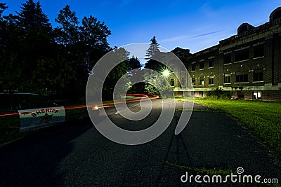 Sunset / Blue Hour / Dusk with Police Car - Abandoned Hospital Editorial Stock Photo