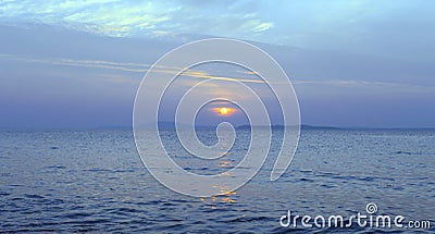 Sunset on blue sea Stock Photo