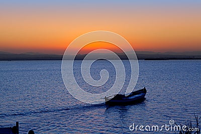 Sunset boat in Albufera lake Valencia Stock Photo