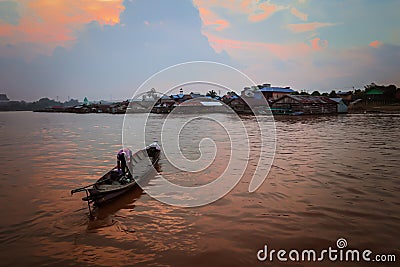 Sunset. Boat in river Kahayan Palangka Raya city Editorial Stock Photo