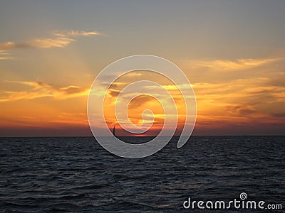 Sunset with boat silhouetted Stock Photo