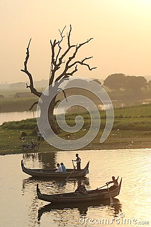 Sunset on the boat, view from U Bein Bridge Editorial Stock Photo